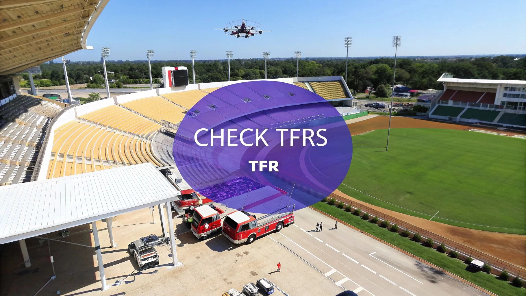 Aerial view of a drone flying over a stadium with fire trucks and a 'CHECK TFRS' overlay.